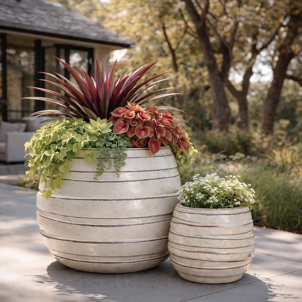 Metropole Planter planters in 15" and 25" sizes on outdoor patio.
