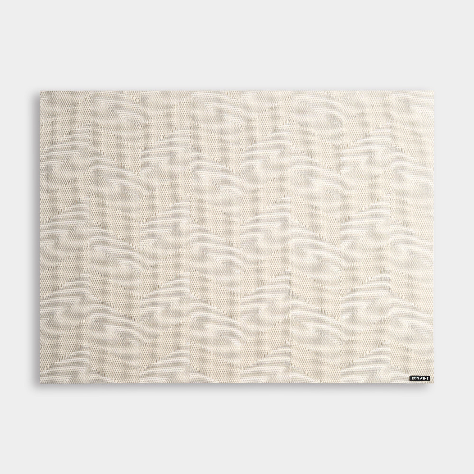 Rectangular woven vinyl placemat with beige chevron pattern