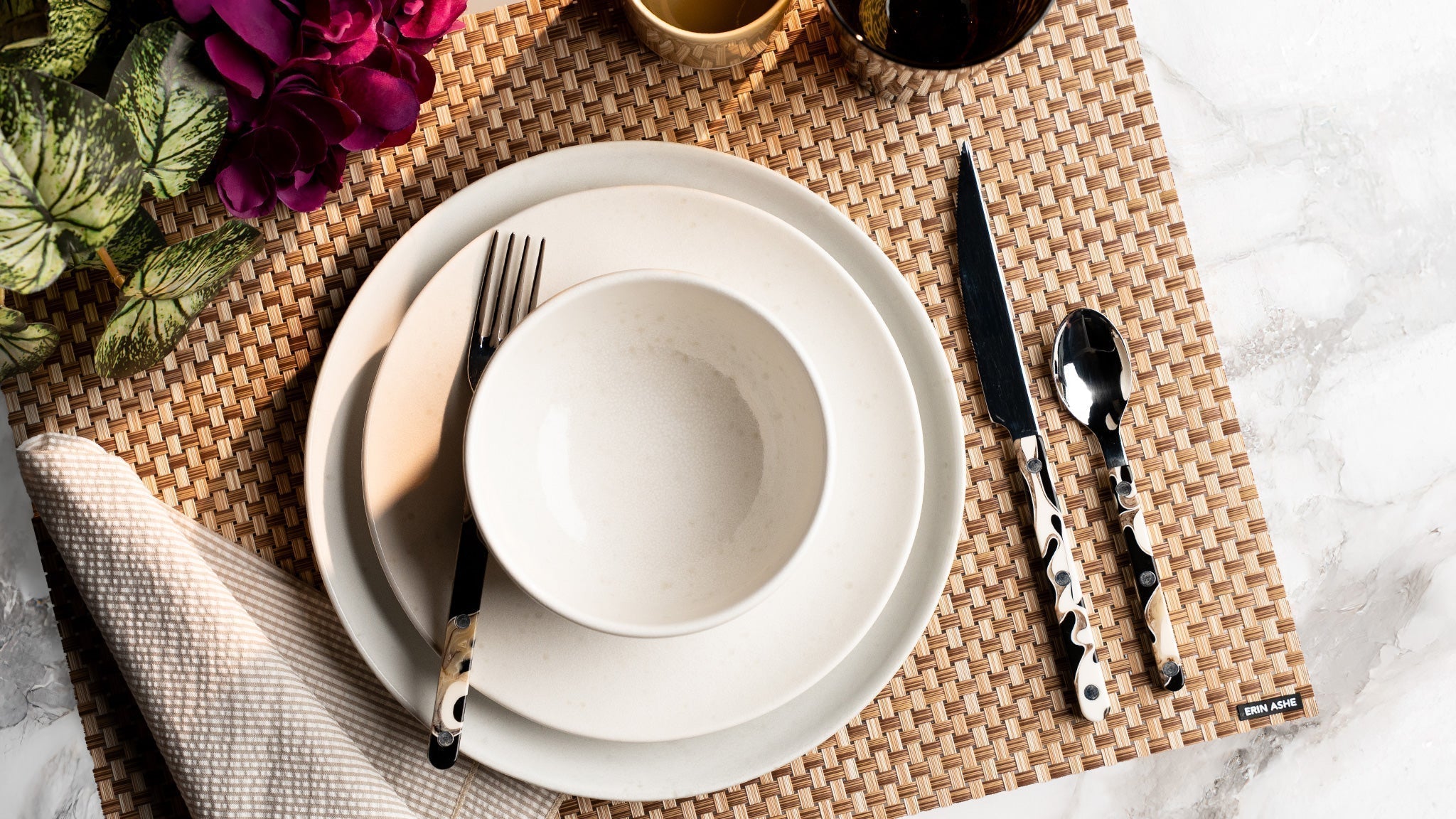 Erin Ashe woven vinyl placemats on outdoor dining table